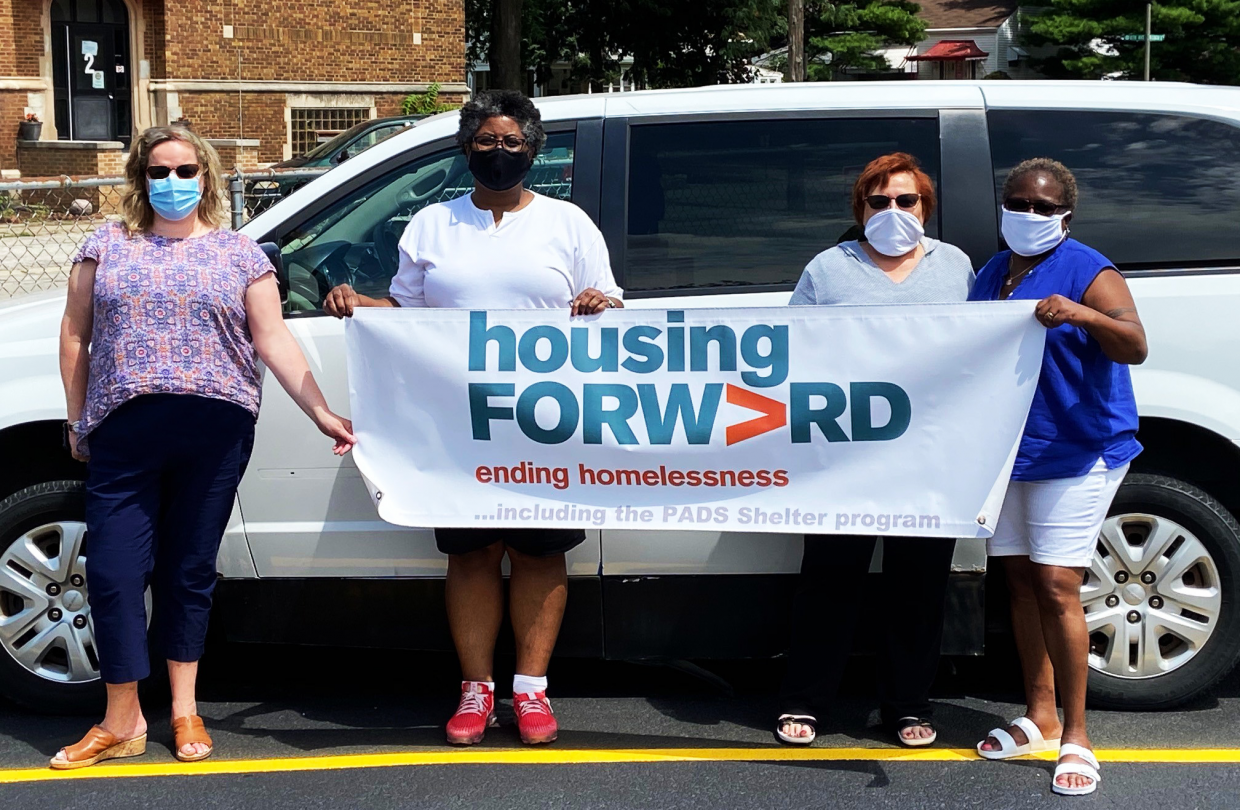 Staff members with donated van.