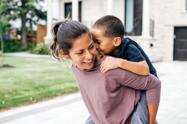 Mother and Son in front of Apartment